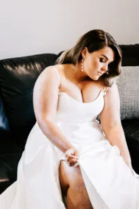 Professional videography capturing bride in elegant white gown