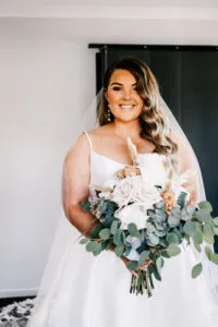 Professional videography photography and drone footage bride smiling