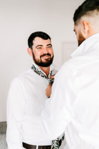 Professional videography photography drone footage groom preparation