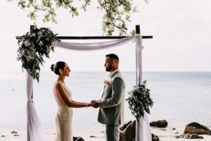 Professional videography, photography, drone footage at beach wedding