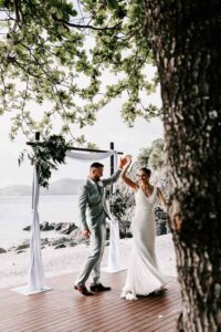 Professional videography photography and drone footage of beach wedding