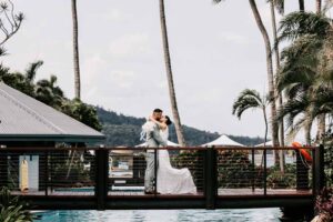 Professional videography wedding couple on a tropical bridge