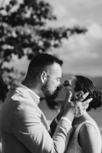 Professional videography photography and drone footage of couple kiss