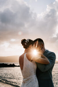 Professional videography of a couple embracing at sunset beach