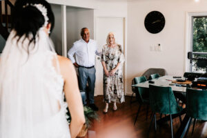 Professional videography captures a wedding moment in living room