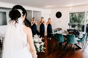 Professional videography capturing bride and bridesmaids moment