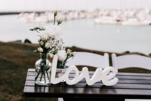 Professional videography love decor with flowers at marina event