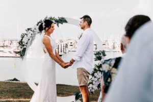 Professional videography, photography, couple at outdoor wedding ceremony