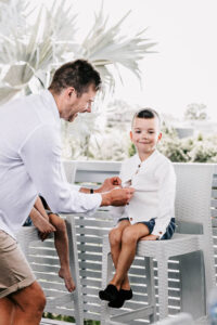 Professional videography, photography, father dresses son outdoor