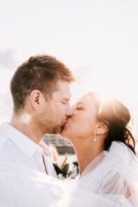 Professional videography wedding couple kiss in sunlight