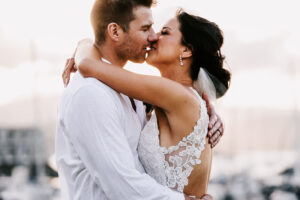 Professional videography photography and drone footage of couple kissing