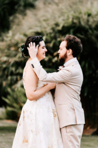 Professional videography wedding couple in elegant attire outdoors