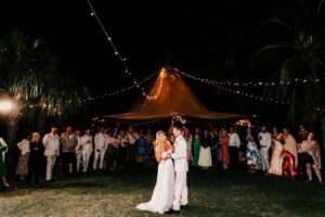 Professional videography at an outdoor nighttime wedding scene