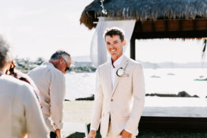 Professional videography at a sunny beach wedding ceremony