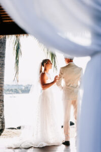 Professional videography capturing a beachside wedding moment