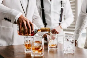 Professional videography, photography, and drone footage of stylish event bartending with drinks being served