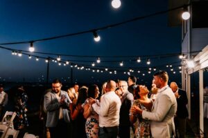 Professional videography outdoor wedding reception under lights