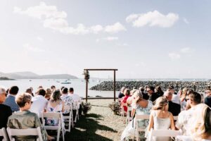 Professional videography photography and drone footage of outdoor wedding ceremony by the sea