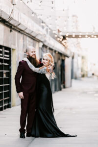 Professional videography couple posing in urban setting