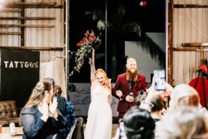 Professional videography capturing a joyful wedding entrance