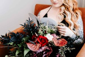 Professional videography with woman holding wedding invitation