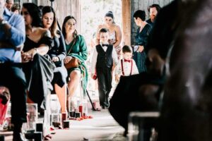 Professional videography of a wedding ceremony with guests seated