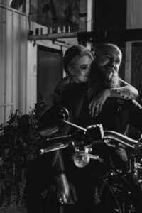 Professional videography, photography, couple on motorcycle embrace