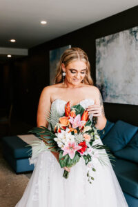 Professional videography wedding bride with floral bouquet indoors