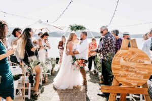 Professional videography, photography, and drone footage at beach wedding ceremony