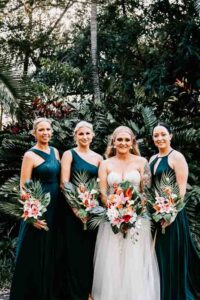 Professional videography of smiling bride and bridesmaids outdoors