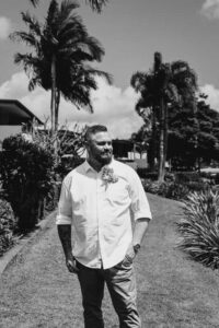 Professional videography outdoors man standing in tropical garden