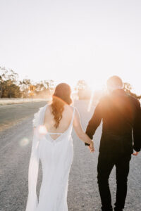 W+R 12-08-23 Th3rd Dimension Media WR-745 Professional videography capturing couple walking at sunset road