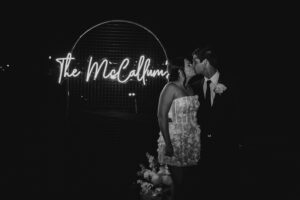 Professional videography couple kissing at elegant night wedding