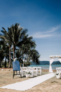 Professional videography of elegant outdoor beach wedding setup