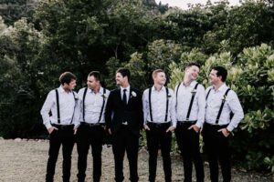 Professional videography groomsmen in nature-themed wedding