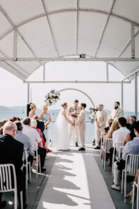 Professional videography, photography, and drone footage wedding ceremony by the sea