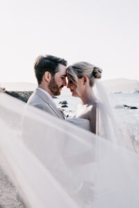 Professional videography capturing a couple's romantic moment on beach