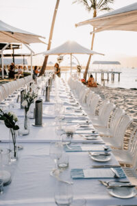 Professional videography beach wedding setup with elegant tables