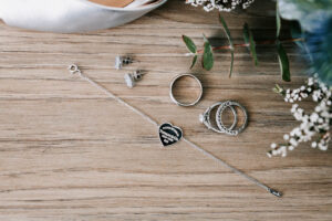 Professional videography jewelry arrangement on wooden surface