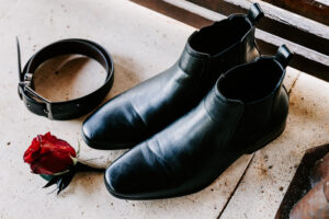 Professional videography elegant shoes with belt and red rose