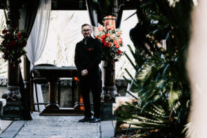 Professional videography at elegant outdoor wedding ceremony