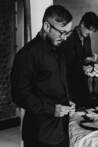 Professional videography, photography, man in black shirt indoors