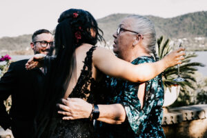 Professional videography capturing a joyful hug at an event
