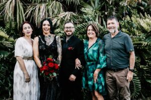 Professional videography group portrait in lush green setting