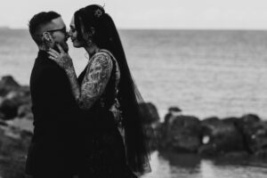 Professional videography photography and drone footage of couple by sea