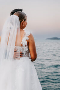 Professional videography photography and drone footage of wedding couple by the sea