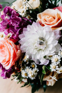 Professional videography floral arrangement with wedding rings