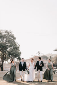 Professional videography with elegant bridal party outdoors