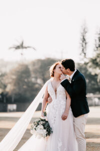Professional videography couple kissing in elegant wedding scene
