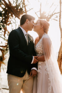 Professional videography wedding couple kissing in sunset light